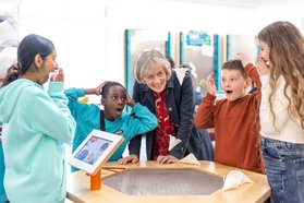 Dame Angela with children St Francis Church of England School